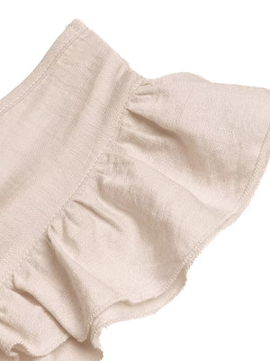Beige ruffled V-neck wide-leg romper with textured fabric detail.