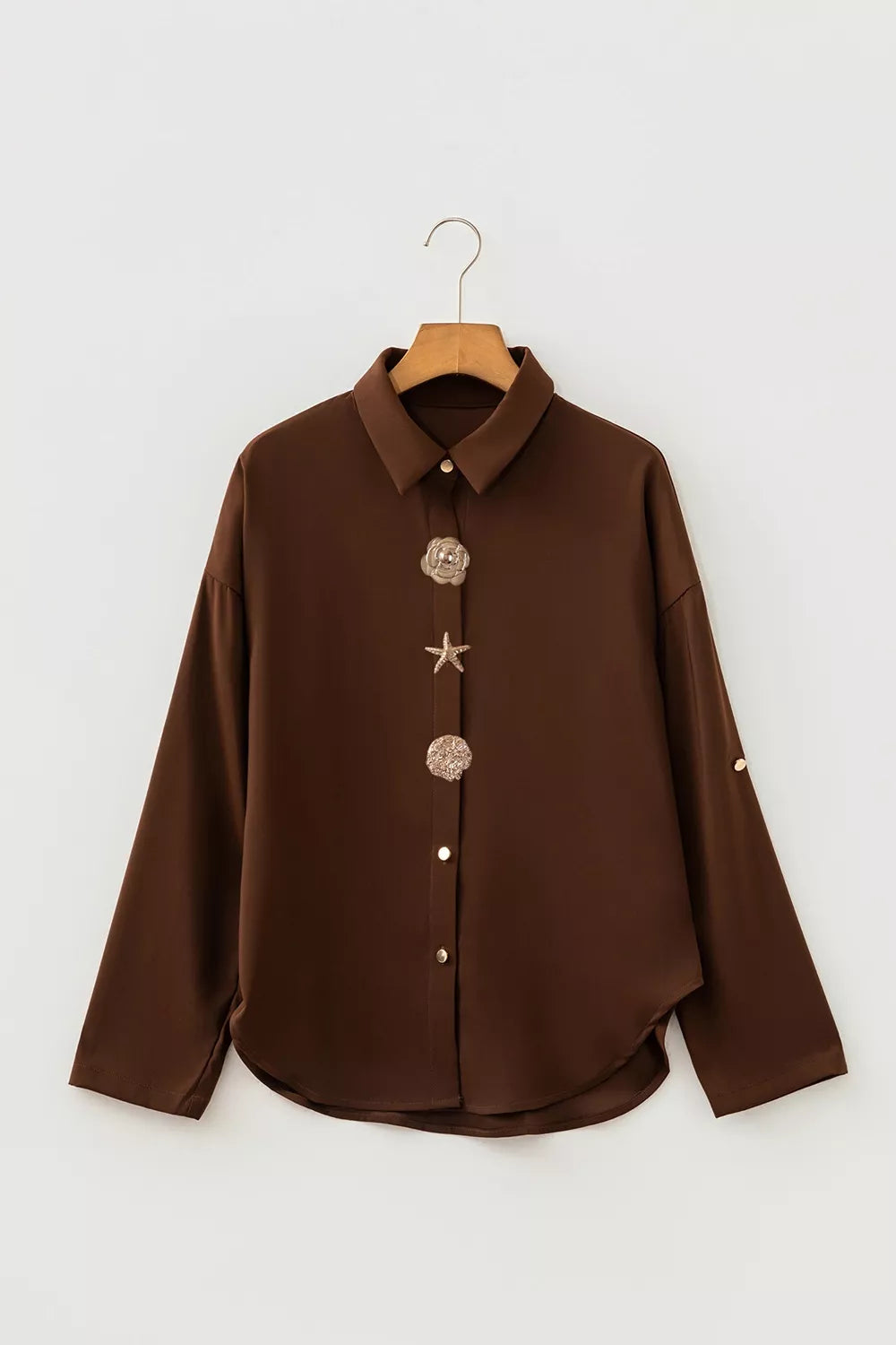 button-up shirt in dark brown with buttoned and hip-length
