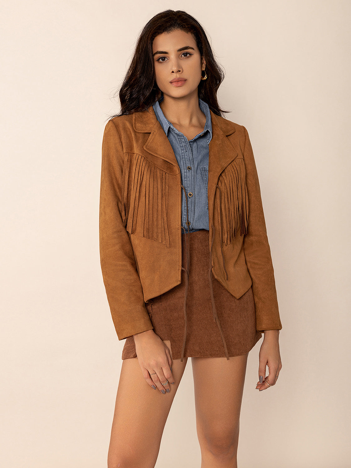 Caramel suede jacket with fringe detail and tie closure, collared, long sleeves.