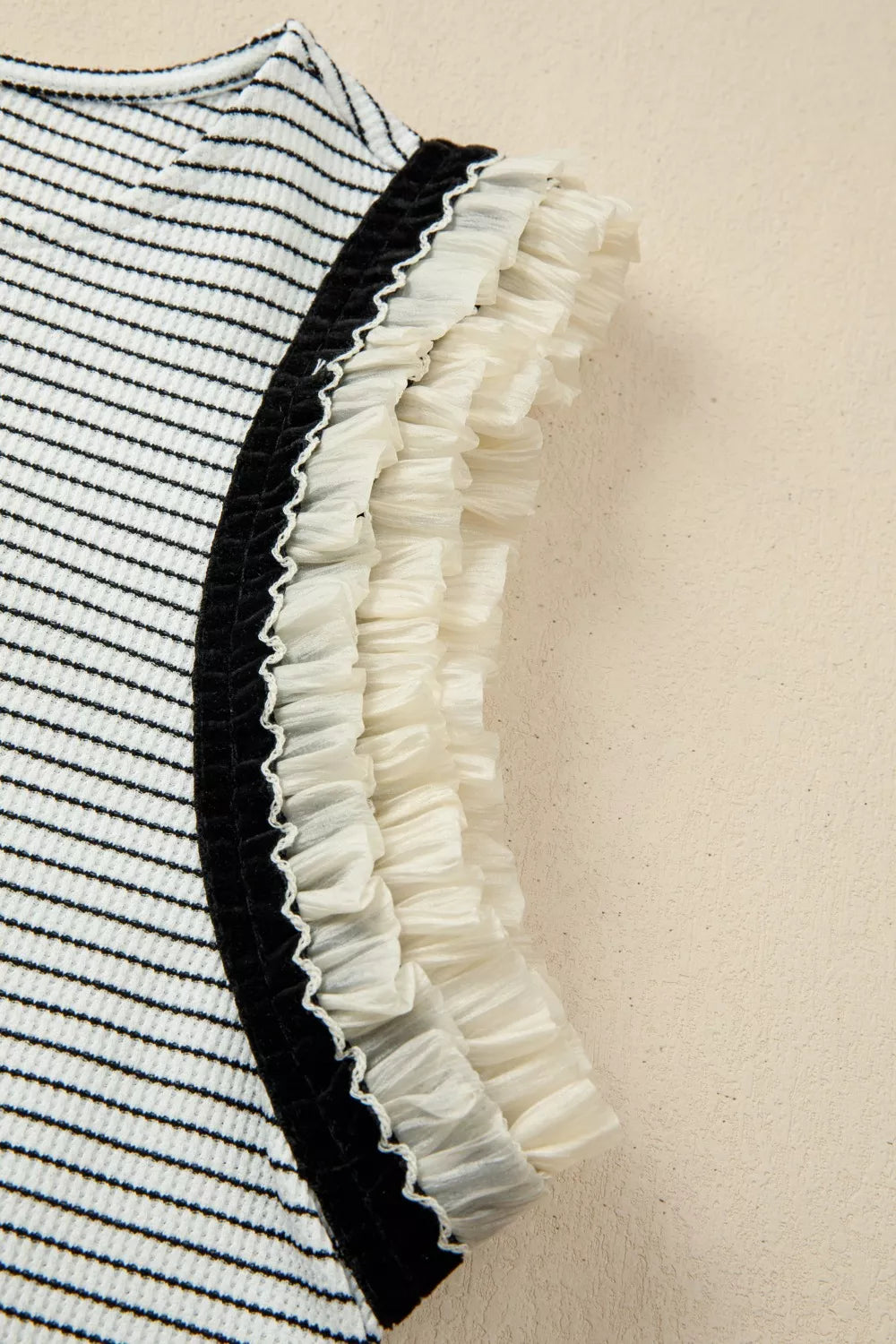 Ruffled stripe detail tank top with black velvet trim and cream ruffles.