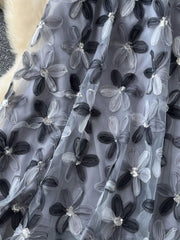 Gray layered skirt with 3D floral embroidery and sequin details.