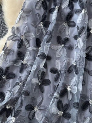 Gray layered skirt with 3D floral embroidery and sequin details.