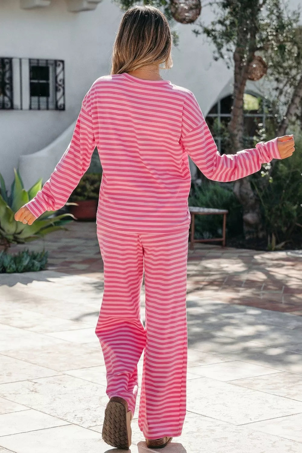 Pink striped cotton two-piece set with crew neck top and wide-leg pants.
