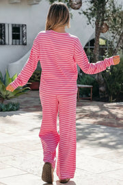 Pink striped cotton two-piece set with crew neck top and wide-leg pants.