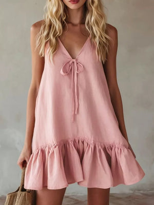 Pink tie-front mini dress with ruffle hem and V-neckline.