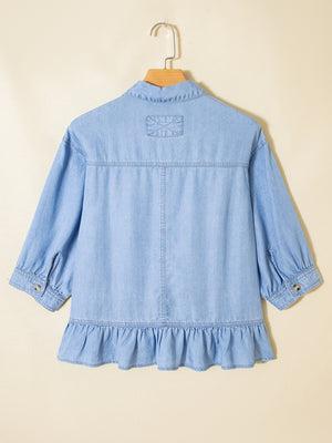 Light blue chambray button-down shirt with ruffled hem and 3/4 sleeves.