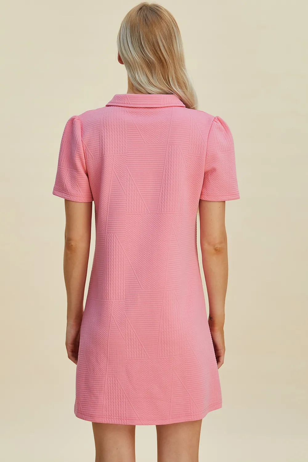 Pink textured short sleeve mini dress with geometric pattern and collar
