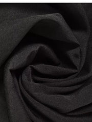 Black midi dress fabric detail, showing texture and drape.