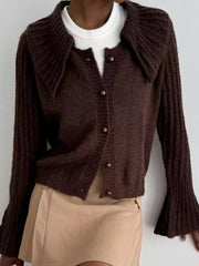Chocolate acrylic cardigan with oversized collar and pearl buttons, bell sleeves.