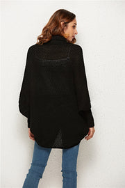 Black textured cocoon knit cardigan with batwing sleeves and a high neckline.