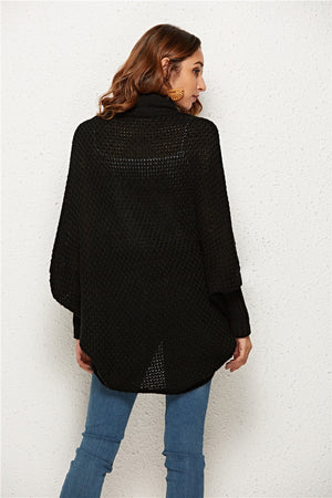 Black textured cocoon knit cardigan with batwing sleeves and a high neckline.