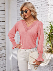 Coral lace trim V-neck blouse with blouson sleeves and smocked cuffs.