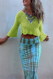 Lime crochet crop top with bell sleeves and a V-neck, styled with a tie-dye skirt.