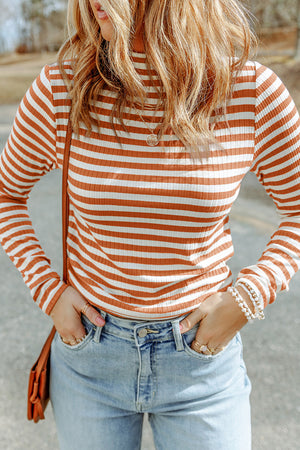 Ribbed turtleneck sweater with orange and white stripes, slim fit, long sleeves.