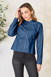 Faux leather biker jacket in French Blue with a mock neck and rose gold zipper.
