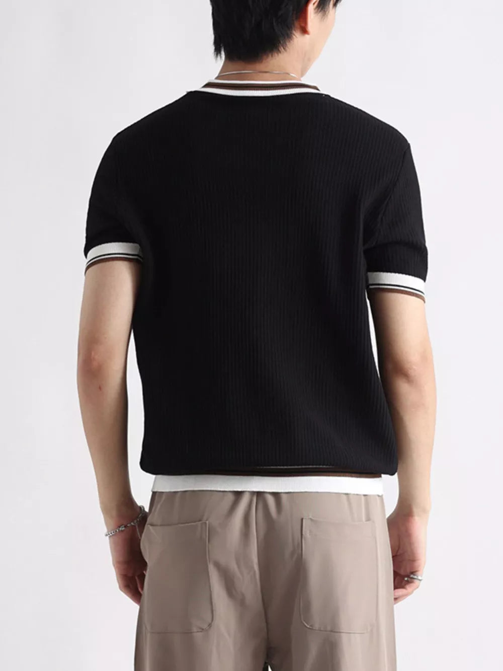 Black ribbed crew neck t-shirt with striped trim on sleeves and neckline