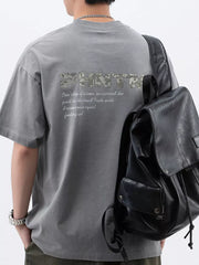 Men's dark gray cotton t-shirt with round neck and letter graphic on back.