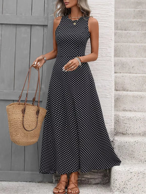 Black polka dot maxi dress with a flattering silhouette, sleeveless, and round neck.