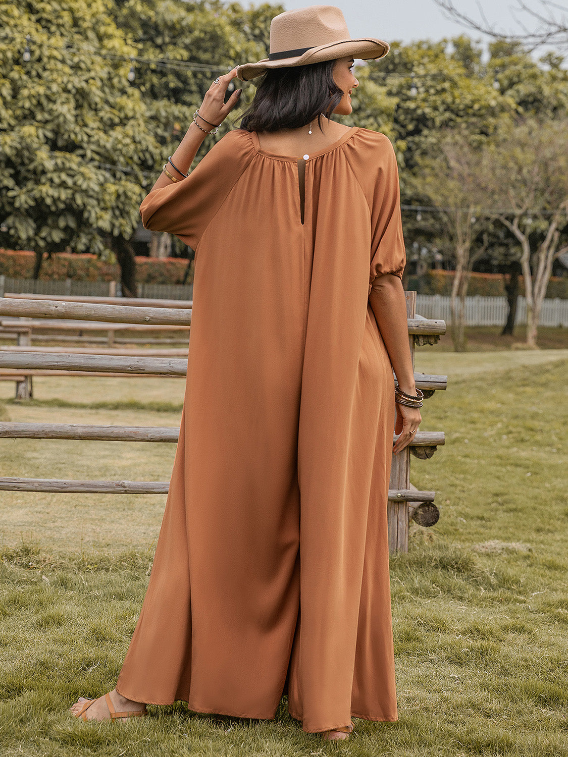Caramel gathered sleeve wide-leg jumpsuit with buttoned back detail.