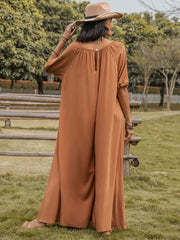 Caramel gathered sleeve wide-leg jumpsuit with buttoned back detail.