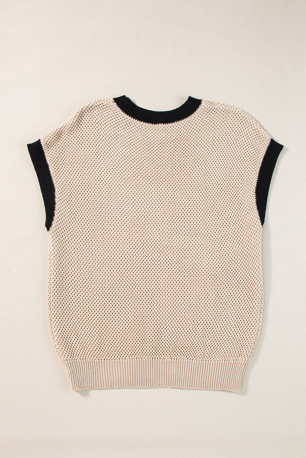 Beige knit cap sleeve top with black trim and crewneck.