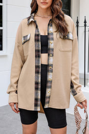 Tan waffle knit overshirt with plaid trim, button front, and chest pockets.