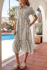 Print button-down midi dress with drawstring waist and short sleeves, featuring a leopard pattern.