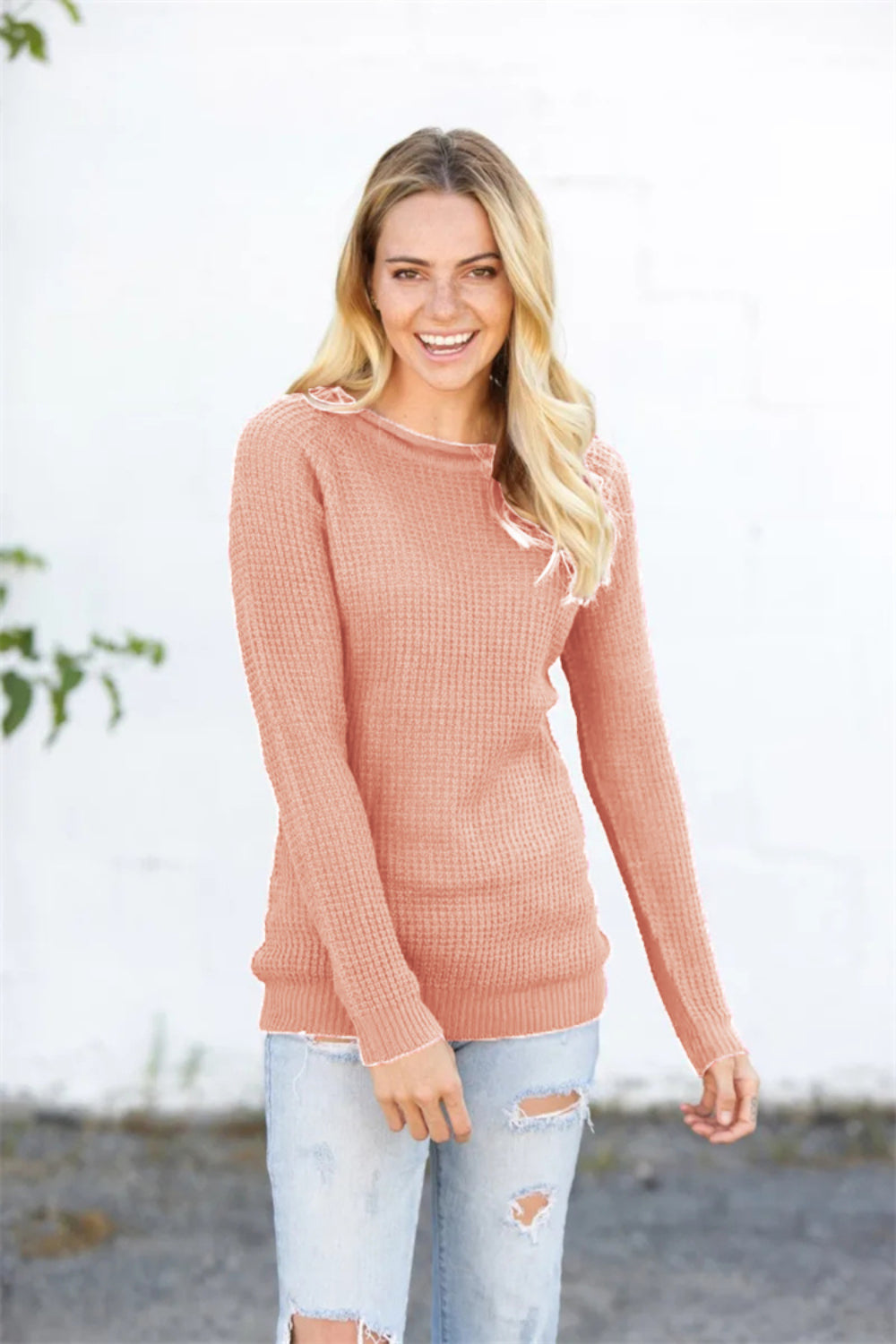 Textured raglan pullover sweater in watermelon pink acrylic with honeycomb knit pattern.