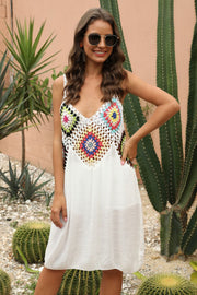 White maxi dress with colorful crochet yoke detail and V-neckline