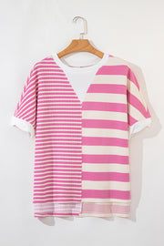 Pink and cream striped waffle knit top with a V-neck detail and short sleeves.