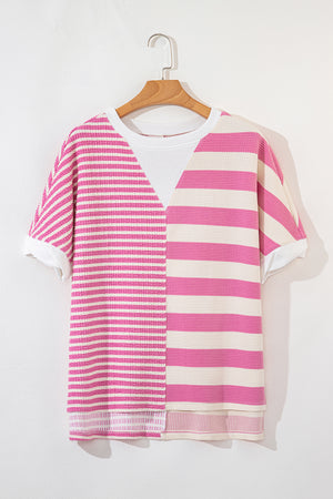 Pink and cream striped waffle knit top with a V-neck detail and short sleeves.