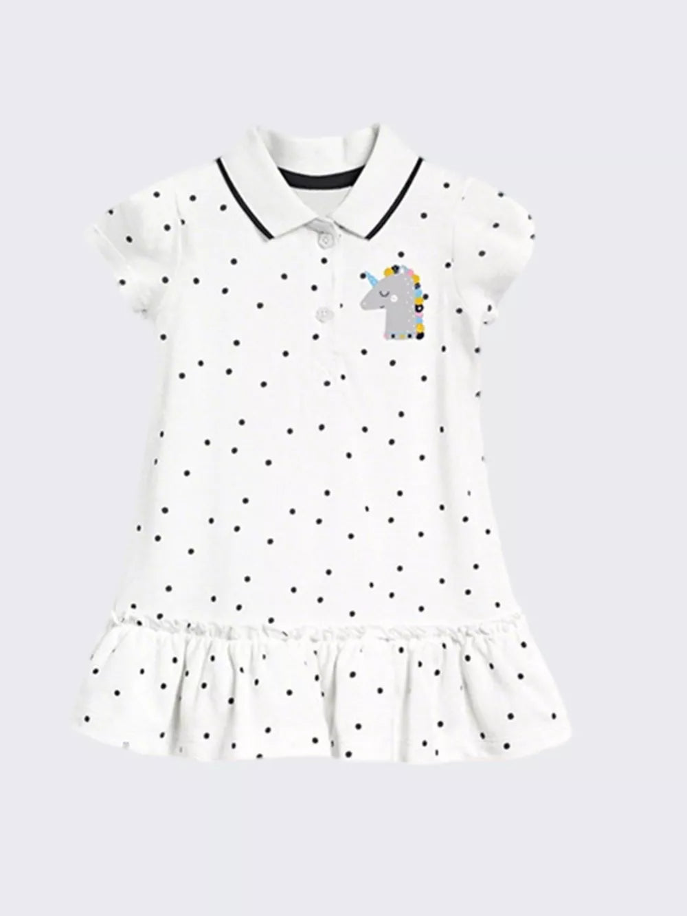 White polka dot cotton dress with unicorn patch and ruffled hem.