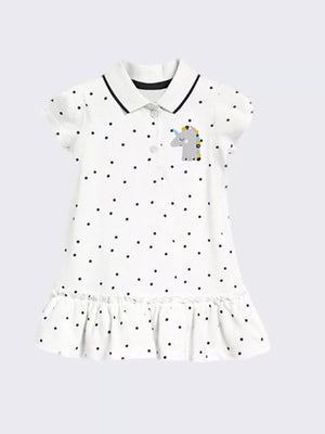 White polka dot cotton dress with unicorn patch and ruffled hem.