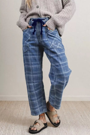 Plaid denim jeans with drawstring waist and grommets in dusty blue cotton.