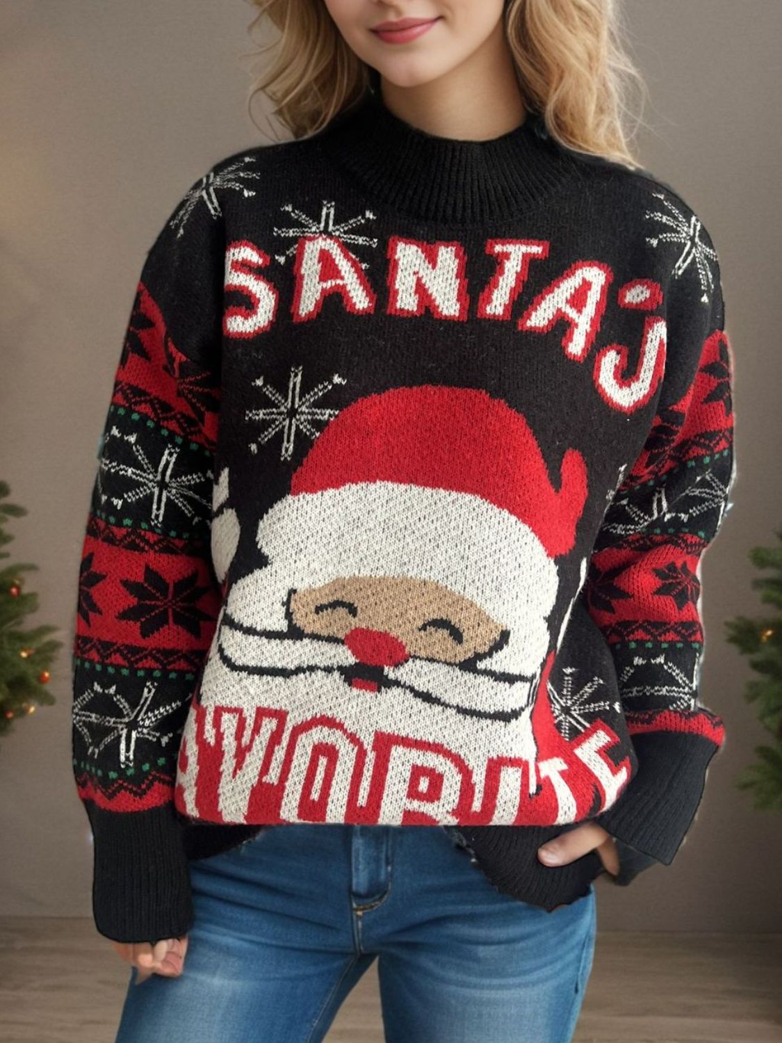 Black acrylic Santa graphic knit sweater with snowflake and stripe sleeve details.