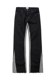 Black cotton bootcut jeans with contrast grey side panels and raw hems.