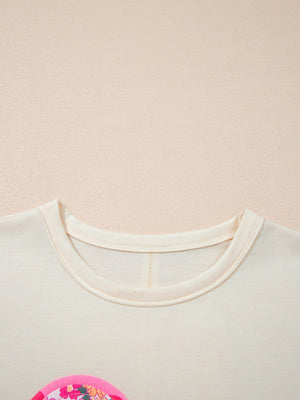 Cream cotton crew neck t-shirt with floral chenille patch detail.