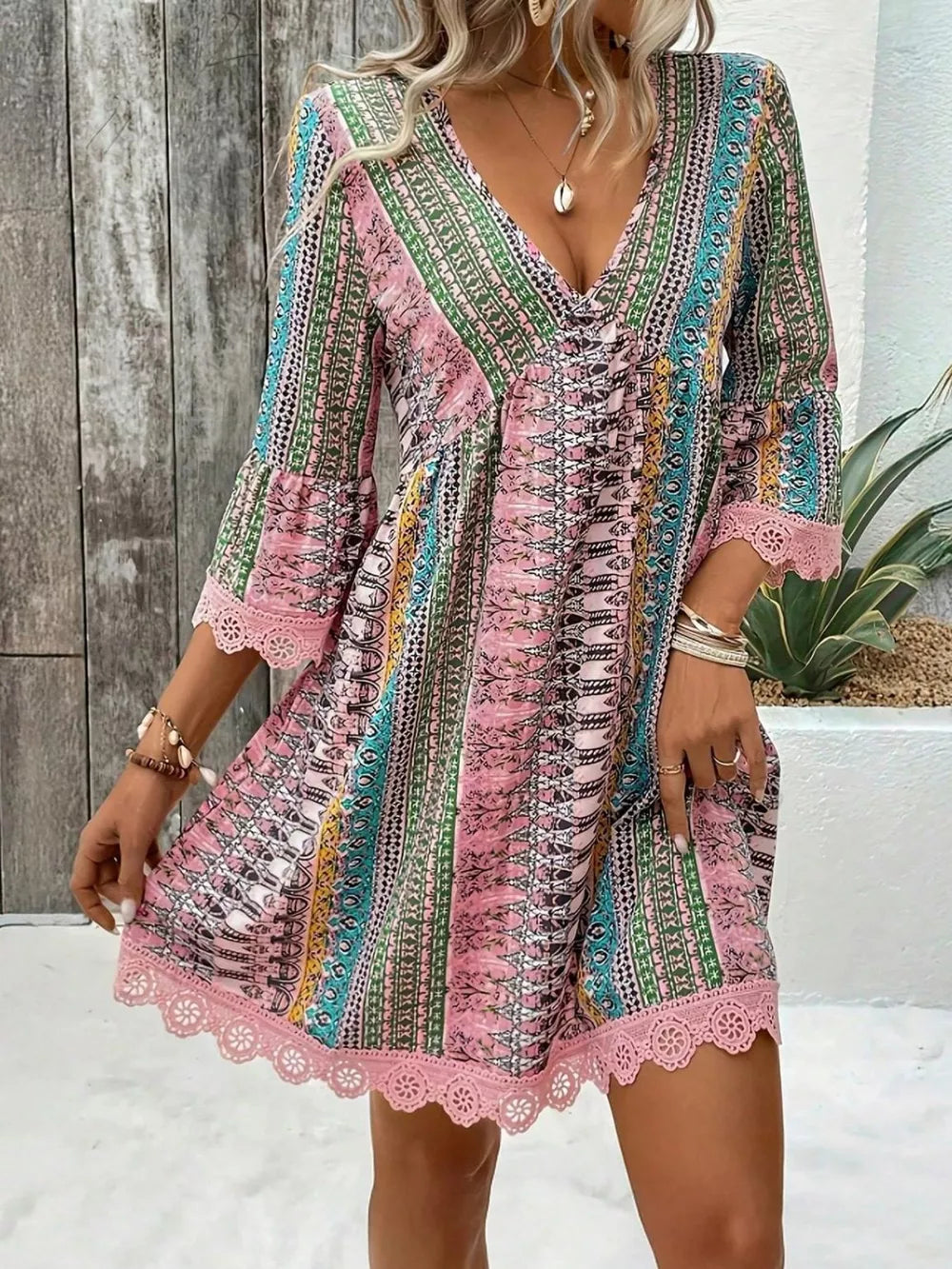 Bohemian printed pink v-neck dress with bell sleeves and lace trim