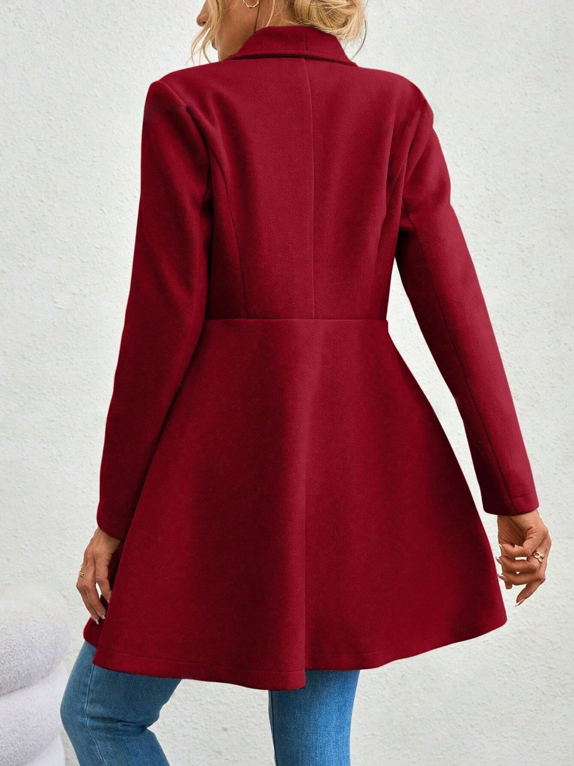 Rust draped collar coat with flare hem and button detail.