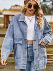 Oversized denim trucker jacket in light wash with collared neck and chest pockets.