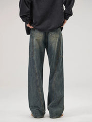 Relaxed fit washed wide-leg jeans in Vintage Blue denim with a baggy cut.