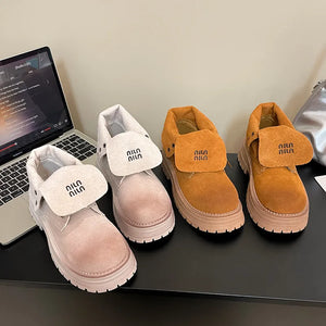 Fold-over suede platform boots in light gray and pumpkin with branding detail.