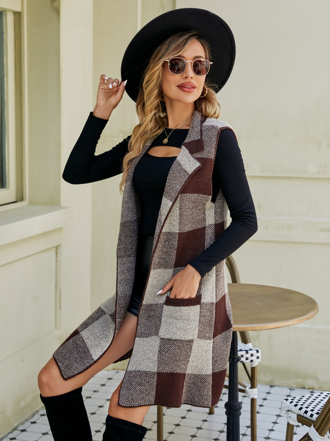 Geometric knit duster vest in brown and tan plaid with pockets.