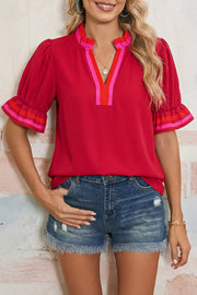 Ruffled red maternity blouse with striped V-neck and sleeve accents