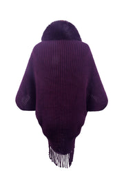 Violet knit cape with faux fur collar and fringe detail