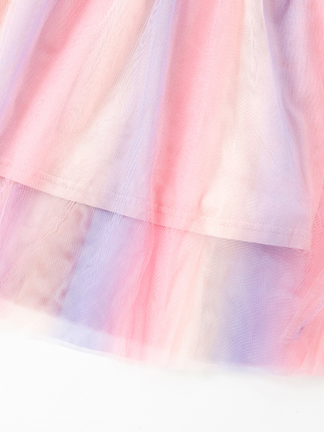 Toddler tulle dress with pastel rainbow tie-dye pattern and layered skirt.