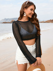 Black crochet crop top with long sleeves and a mesh knit pattern.