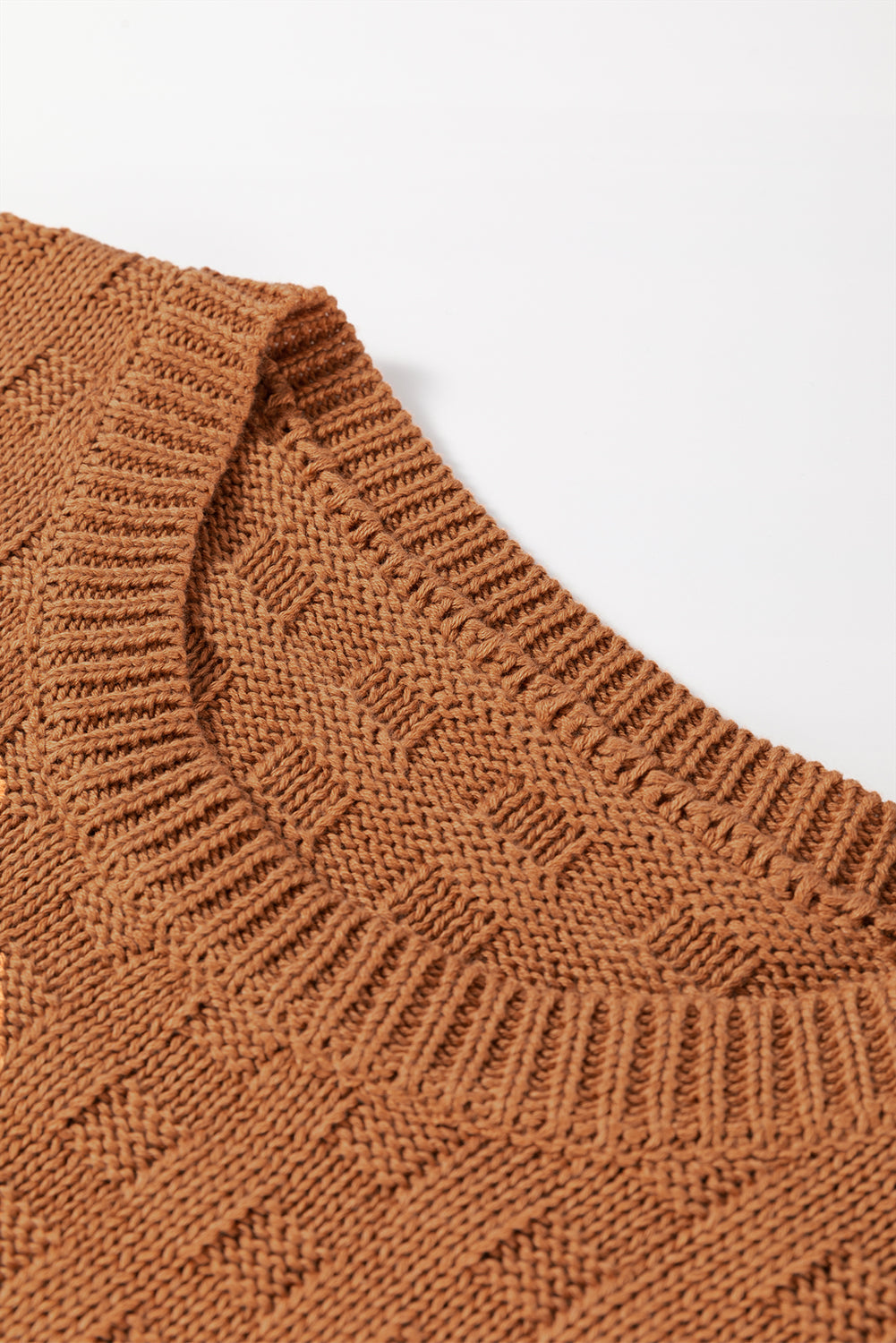 Camel textured knit boxy top with crew neck and ribbed trim.