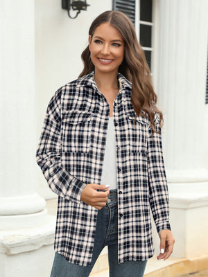 Plaid button-up shirt in black and white with two chest pockets.