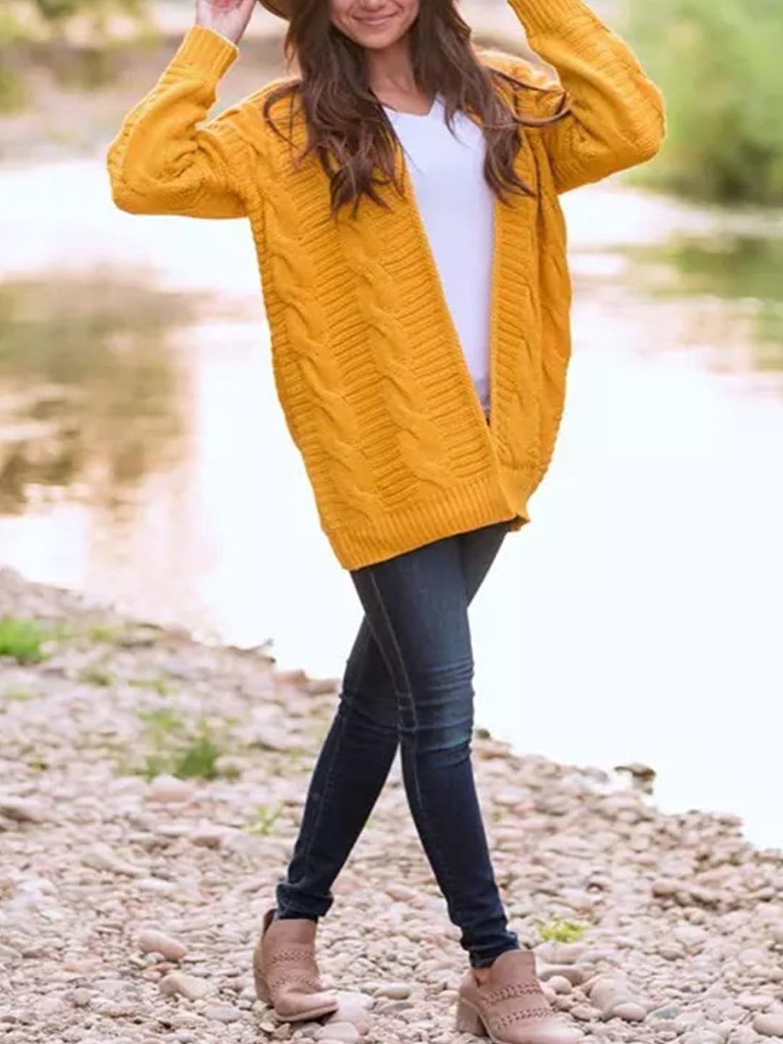Gold cable knit duster cardigan with textured pattern and open front